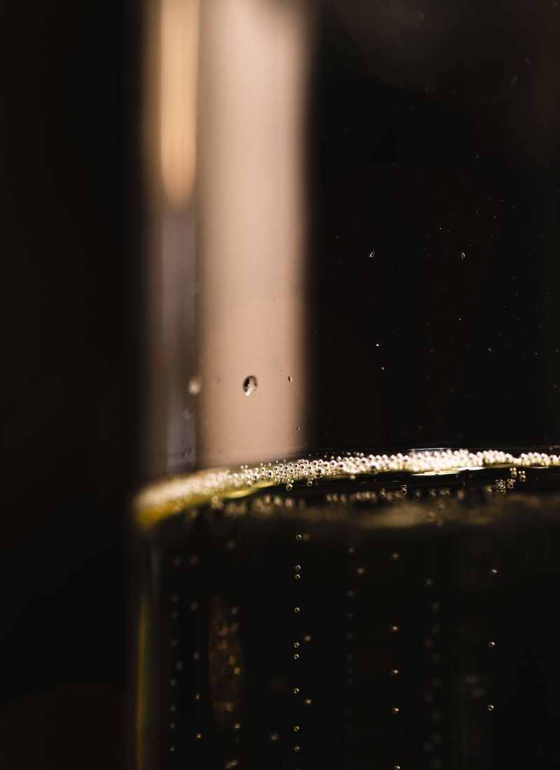 low-angle-glass-with-champagne-bottom